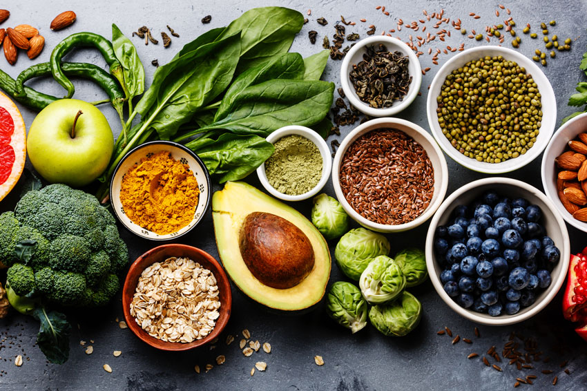 Healthy foods for weight loss including vegetables, berries, fruits, grains and legumes.